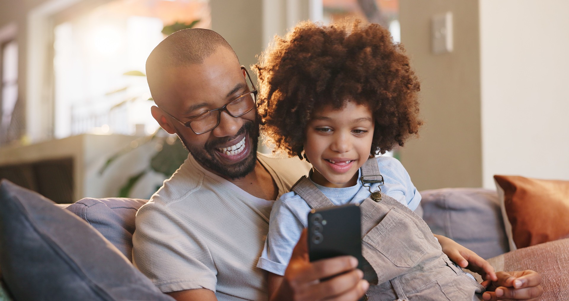 Mobile app, dad or kid in home for social media, bonding or streaming online for movie or website. Technology, download or single parent father with boy, child or touchscreen for learning development